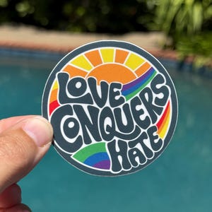Love Conquers Hate Sticker