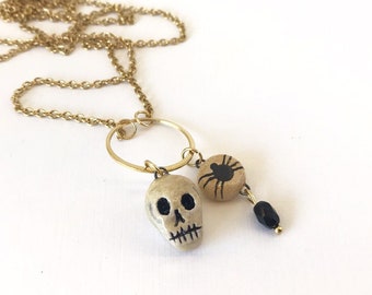 Tiny skull set - ceramic pendants on stainless steel chain