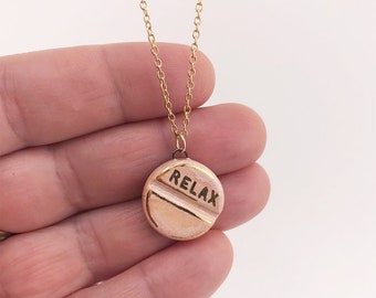 Relax pill - ceramic pendant on stainless steel chain