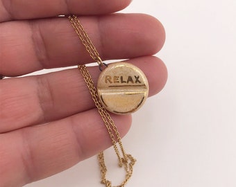 Relax pill - ceramic pendant on stainless steel chain