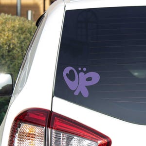 Olivia Rodrigo inspired logo, color of white, self-adhesive vinyl displayed on a car window.