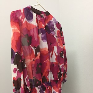 Beautiful ANA blouse in  a sheer floral  fabric with a solid purple under slip,  Size L