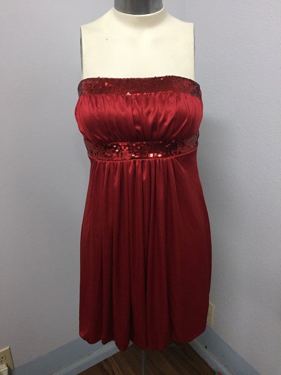 Strapless Red satin party dress with sequins at th