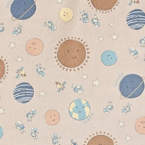 May include: A beige fabric with a repeating pattern of planets, stars, astronauts, and a sun. The planets are blue, yellow, and brown with smiling faces. The stars are white. The astronauts are wearing white spacesuits. The sun is brown with a smiling face. The text "Saturn" and "Earth" are written on the planets.
