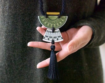 Stylish 'Delamere' stoneware tassel pendant on long black twisted cotton rope.