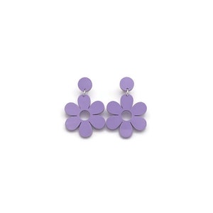 May include: A pair of lavender dangle earrings featuring a flower design. The earrings are made of acrylic and have a simple, modern style.