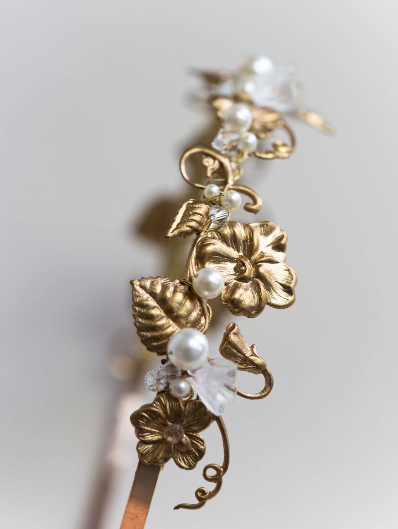 Close-up of gold headband with pearl and crystal accents, Edwardian bridal hairpiece