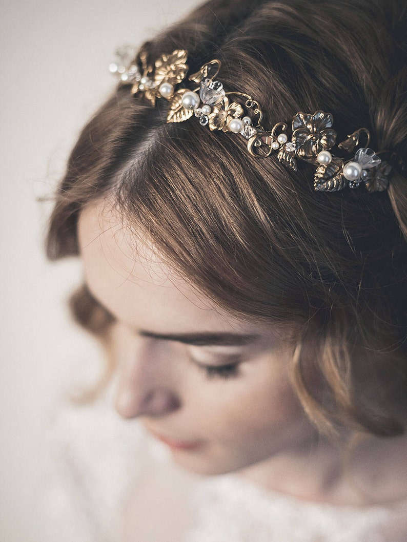 Close-up of gold brass headband with pearl and crystal accents, Edwardian style bridal headpiece