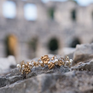 Edwardian inspired bridal headband photographed outdoors, brass flowers and pearl accents