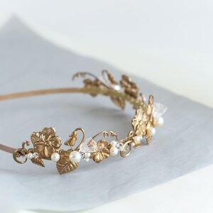 Gold wedding headband with brass flowers and pearl details, refined Edwardian style hair accessory