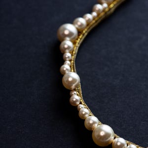 Scalloped pearl tiara with crystal accents.
