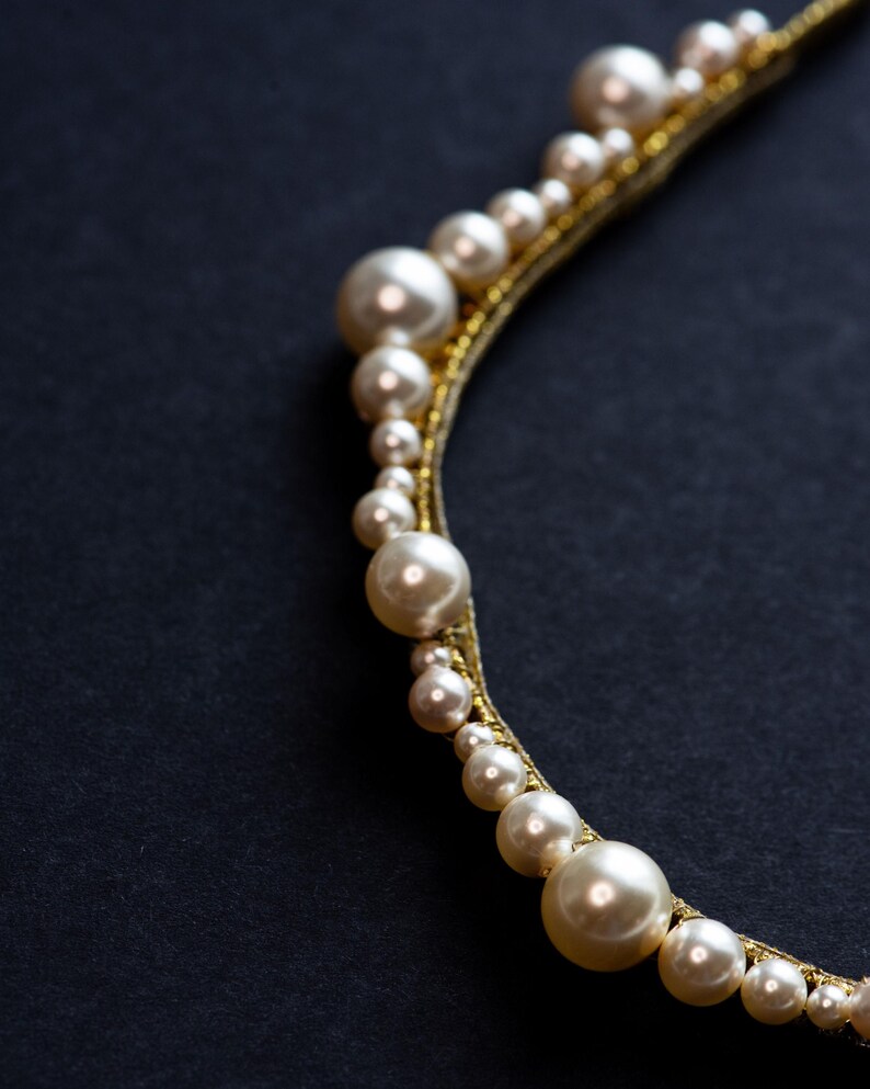 Scalloped pearl tiara with crystal accents.