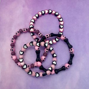 pink and black emo style skulls bones hearts bracelets alternative punk goth