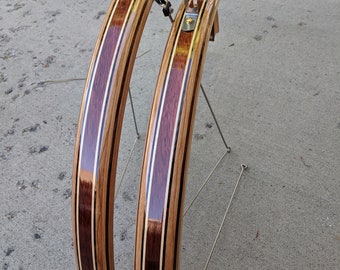 Wooden bicycle fenders- Fully Shaped Compound Curve Cherry, Blood wood center with Maple and Thermo Ash highlights.  Stainless hardware.