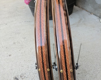 Wood bicycle fenders hand made from Leopard wood, Wenge, and Walnut.  Set comes complete with all stainless mounting hardware.