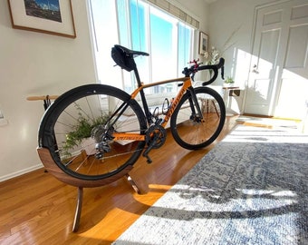 Bicycle parking stand made from Walnut.  Great looking bike stand to show off your favorite bicycle.  Great gift idea for cyclists!