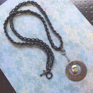Deja Neux: Millie - Long statement pendant necklace in black and silver made with repurposed earrings and chain