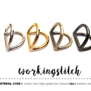 May include: Four metal D-rings in different finishes: silver, gold, brass, and black. The rings are all the same size and shape, and they are arranged in a row.