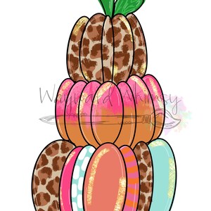 May include: A stacked pumpkin decoration with a variety of patterns and colors. The top pumpkin has a brown and tan leopard print. The middle pumpkins are pink and orange. The bottom pumpkins have patterns including leopard print, polka dots, and stripes. The stem is green.