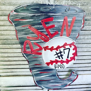 May include: A gray and red baseball-shaped door hanger with the name "RJEN" and the number "#7" on a white baseball. The baseball also has the letters "BMS" written on it.