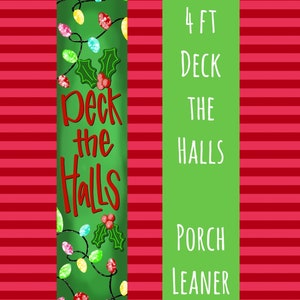 May include: Green porch leaner sign with the text "Deck the Halls" in red lettering. The sign is decorated with a string of colourful lights and holly. The sign is 4 feet tall and is designed for a porch.