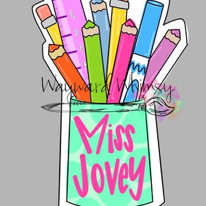 May include: A colorful illustration of school supplies in a teal container with the text "Miss Jovey". The image includes pencils, a ruler, and a marker. The pencils are in various colors, including orange, yellow, green, pink, and blue.