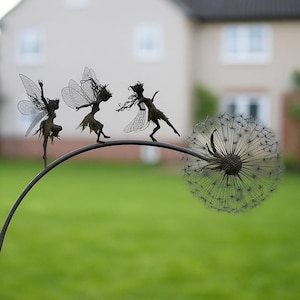 Dancing steel wire fairy with dandelion – a magical miniature sculpture for garden, patio, or fairy yard decor. Whimsical and elegant.