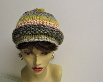 May include: A knitted hat with stripes of green, yellow, pink, and grey.