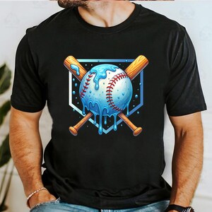 May include: Black t-shirt featuring a baseball design. The graphic shows a baseball with blue dripping accents, red stitching, and crossed wooden bats. The design is set against a blue and white shield.