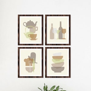 May include: Four framed prints with abstract illustrations of kitchen items, such as a teapot, wine glasses, a chef's hat, and bowls, hanging on a white wall above a wooden table with four chairs.
