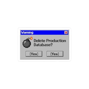 May include: A sticker with a retro computer interface design. The blue header reads "Warning" above a pixelated bomb graphic. The text "Delete Production Database?" is displayed, with "[Yes]" buttons below. A nostalgic design.