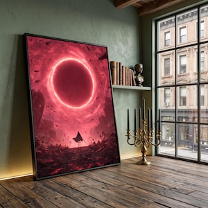 May include: Framed art print featuring a dramatic fantasy scene. A lone figure stands before a glowing red portal in a desolate landscape. The artwork is framed in black and set against a green wall, with a wooden floor.