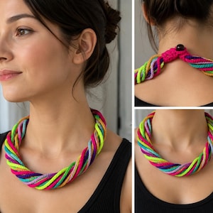 May include: A multi-strand necklace made of twisted neon-coloured yarn in shades of bright pink, lime green, turquoise, purple, and yellow. The necklace features a crocheted closure at the back of the neck secured with a single dark brown bead.