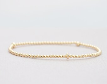 2mm Gold Filled Bracelet with Saucer Gold Beads