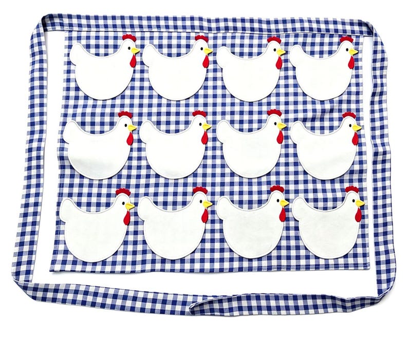 May include: A blue and white gingham apron featuring twelve white chicken appliqu&eacute;s arranged in three rows of four. Each chicken has a red comb and wattle with a yellow beak. The apron includes long fabric ties along the top and bottom edges.