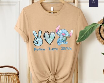 ピースラブスティッチシャツ、キュートスティッチシャツ、ディズニートリップシャツ、オハナグラフィックTシャツ、女性と子供用のパステルカラーのカートゥーンシャツ、ディズニートリップシャツ