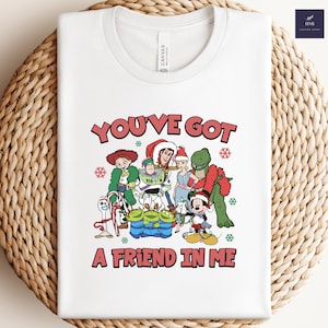 Camiseta navideña con luces de Toy Story de Disney, Buzz Lightyear, Woody, Jessie, Slinky, Mickey y sus amigos.