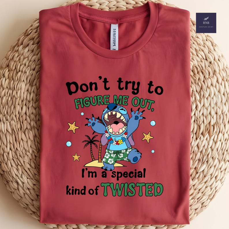 May include: A maroon t-shirt featuring a cartoon character with the text "Don't try to figure me out, I'm a special kind of TWISTED." The character is blue with a floral lei and tropical shorts.