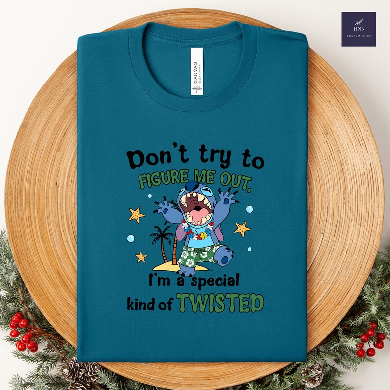 May include: Teal t-shirt with the text "Don't try to figure me out, I'm a special kind of twisted." Features a cartoon character with a wide open mouth, wearing a Hawaiian shirt and shorts. Includes palm trees and stars.