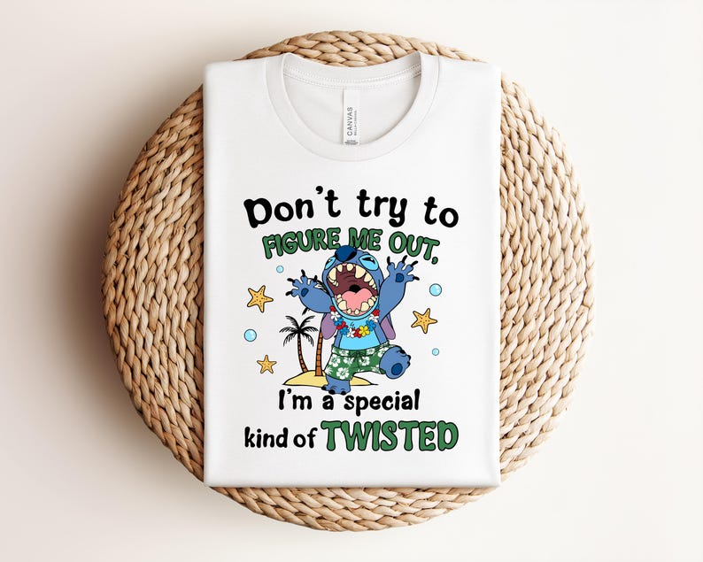 May include: White t-shirt featuring a cartoon character with the text "Don't try to figure me out, I'm a special kind of TWISTED." The character is blue with a wide open mouth, wearing a Hawaiian shirt and shorts. Palm trees and stars are also featured.