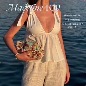 Peut inclure: Haut blanc sans manches avec un col en V plongeant et des bretelles nouées. L'image montre également une pochette perlée avec un motif floral coloré et un short en lin. Le texte sur l'image indique "Madeline TOP" et des informations de taille.