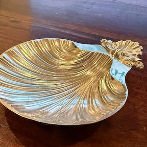 May include: A rustic wooden sign with the text "Welcome to our home" in white lettering. The sign features a distressed finish and a simple, inviting design, perfect for a front porch or entryway.