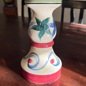 May include: A set of three ceramic nesting bowls in shades of blue, green, and white. The bowls feature a speckled glaze and a simple, modern design. The largest bowl is approximately 6 inches in diameter.