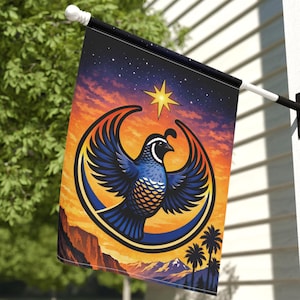 May include: A rectangular garden flag hanging from a black metal pole. The flag features a blue quail with wings spread wide, centered within a yellow crescent moon. The background depicts a sunset sky with a bright star over mountain silhouettes.