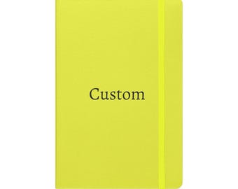 May include: A bright lime green notebook with a vertical elastic band closure. The front cover features the word Custom printed in a dark, serif font centered on the page. The notebook has a clean, rectangular shape with rounded corners.