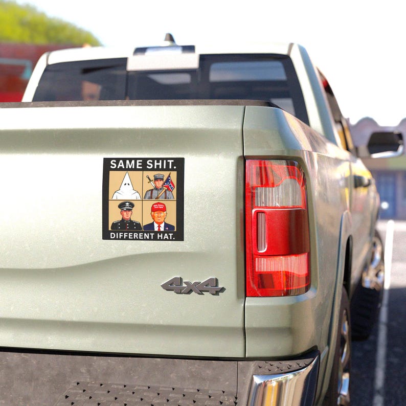 May include: A square sticker on a truck tailgate featuring a grid of four figures: a person in a white hood, a soldier with a flag, a person in a dark uniform, and a person in a red hat. The text reads SAME SHIT. DIFFERENT HAT. in black letters.