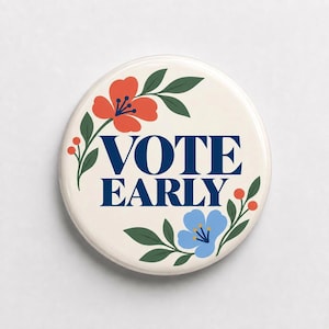 May include: A round pinback button with a cream-colored background featuring the dark blue text VOTE EARLY in the center. The design is framed by illustrated botanical elements including dark green leaves, small orange berries, and two flowers.