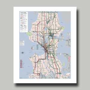 May include: A detailed map of Seattle's public transit system, featuring a network of bus routes and other transit lines. The map uses a color-coded system to differentiate routes, with text that reads "Transit in Seattle". The map is printed on white paper.