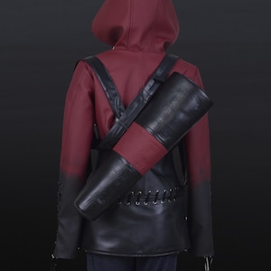 May include: A burgundy hooded jacket with a black leather quiver and straps. The jacket has a gradient effect, transitioning from burgundy to black at the sleeves. The quiver is black with a burgundy accent.