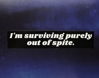 May include: A black and white sticker with the text "I'm surviving purely out of spite."